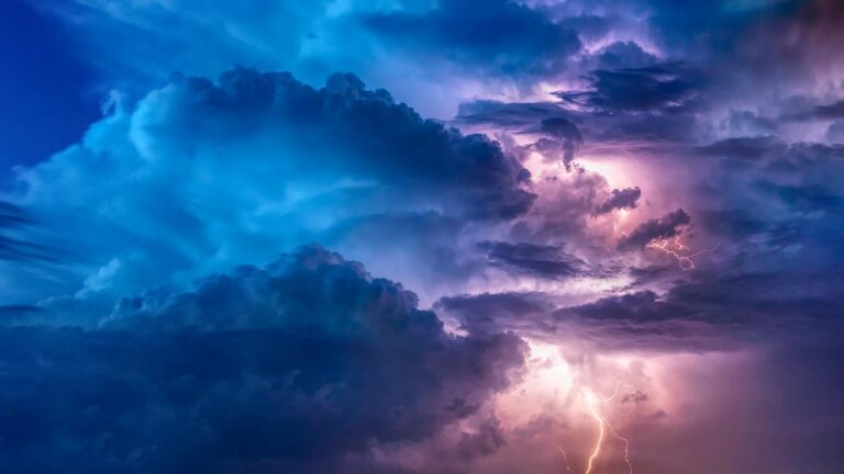 a dark blue sky showing extreme weather